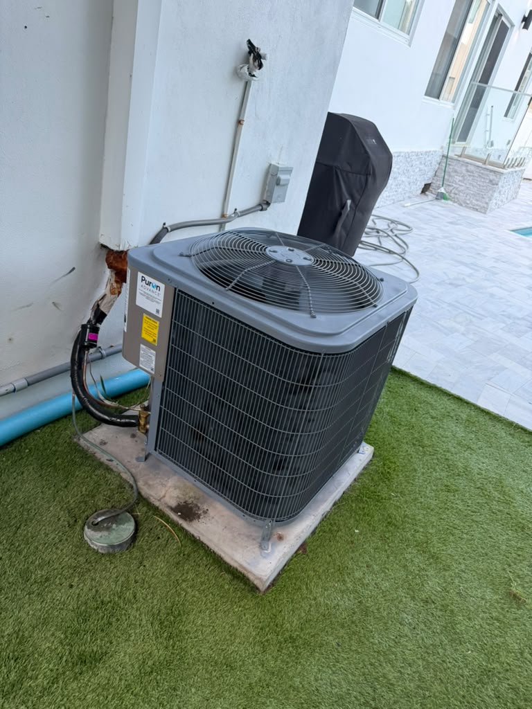 Outdoor air conditioner set on a concrete pad
